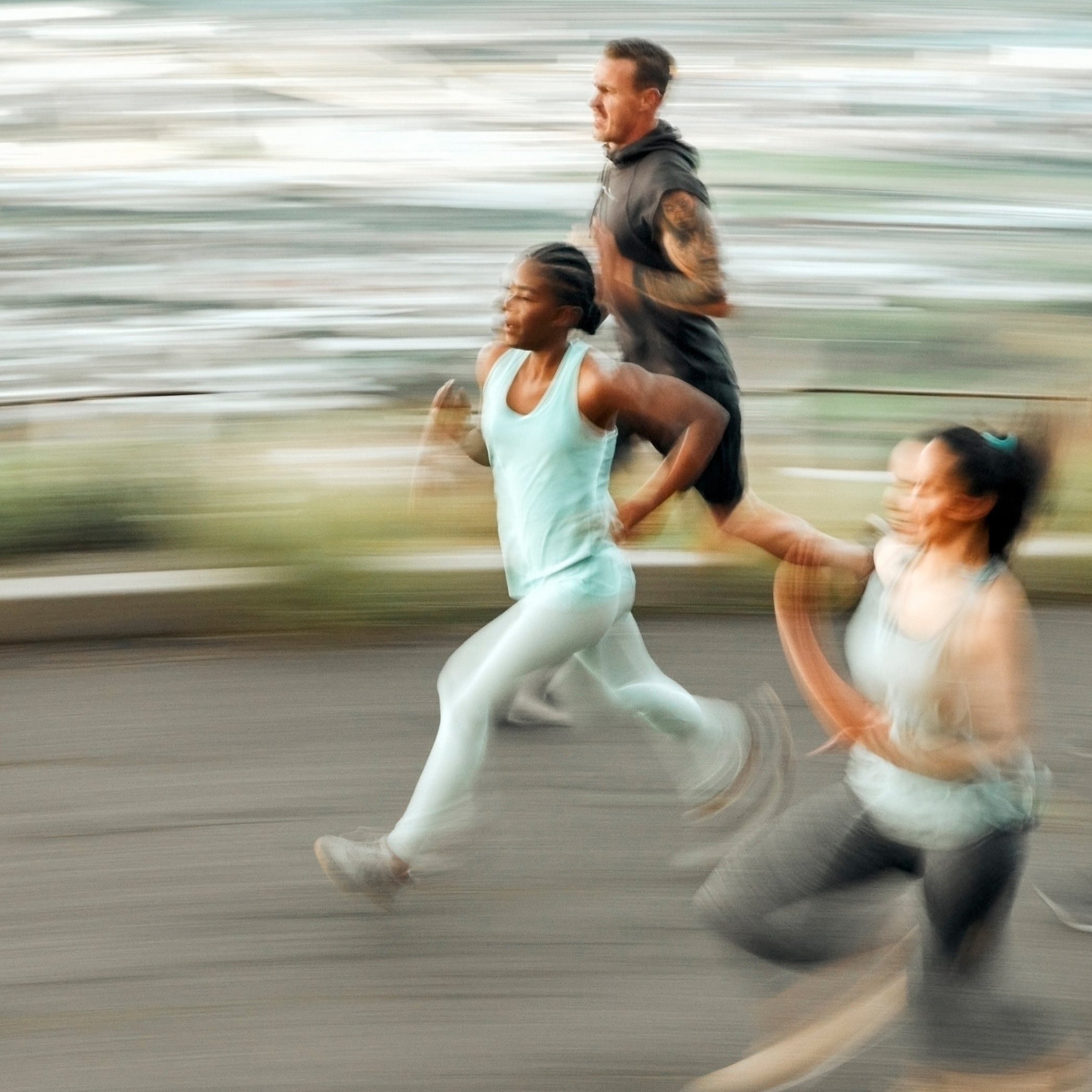 Group of athletes running on road